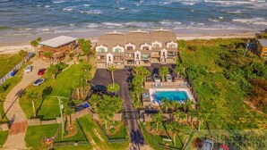A beachfront property with a swimming pool, multiple guest rooms, and a view of the ocean. - NEW LISTING - Oceanfront Condo ~ Excellent Location (Saint Augustine)
