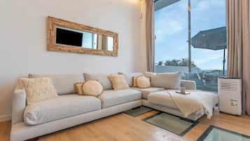 Deluxe Duplex, Ocean View | Living area | Flat-screen TV