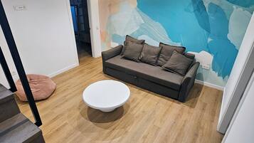 Deluxe Duplex, Ocean View | Living area | Flat-screen TV