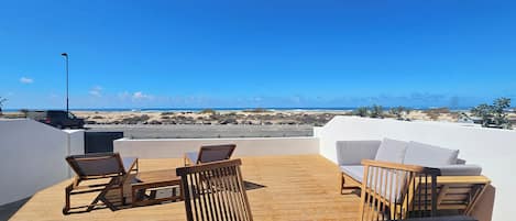 Dúplex Deluxe, vista al océano | Terraza o patio