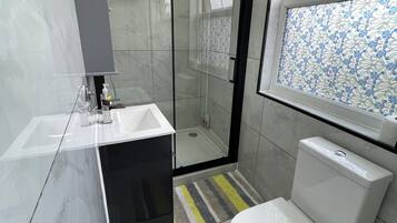 Shower, hair dryer, towels, soap