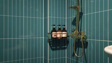 Yellow Double | Bathroom | Hair dryer, towels, soap, shampoo