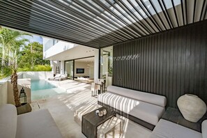 Villa, 4 Bedrooms, Patio, Pool View | Living area | 50-inch TV with cable channels - Villa Uma Bali (Kerobokan)
