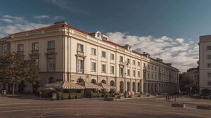 A historic building with a symmetrical facade, large windows, and a central entrance with a canopy. - Flaner Hotel, WorldHotels Crafted (Warsaw)