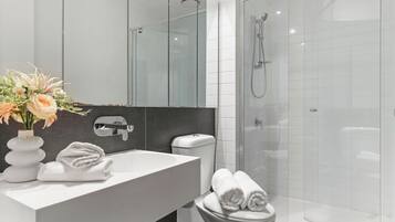 Shower, hair dryer, towels, soap