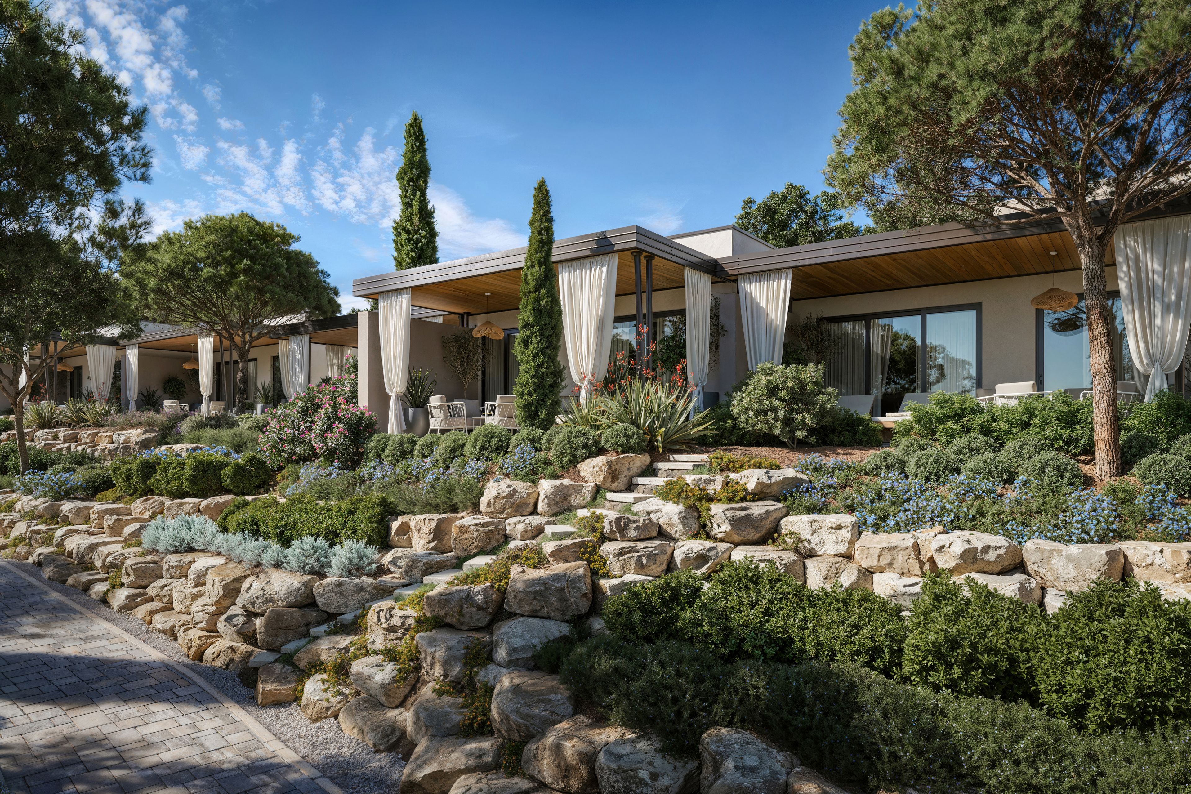 Una casa moderna con un camino de piedra que lleva a un porche cubierto.