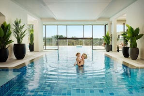 Indoor pool, seasonal outdoor pool, pool umbrellas, pool loungers