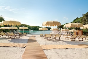 Sun-loungers, beach umbrellas, snorkelling, beach volleyball