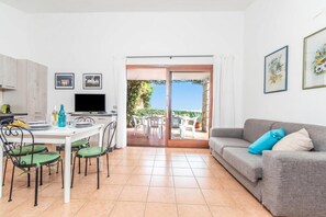 Family Apartment, Multiple Bedrooms, 2 Bathrooms (Villa Laura) | Living area | TV, fireplace - Villa Laura (Arzachena)