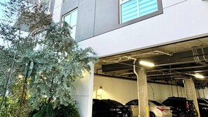 A multi-story parking garage with several cars parked inside. - Bright Hollywood Two Bedroom with Free Parking (Hollywood)