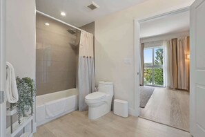 Shower, hair dryer, towels, shampoo