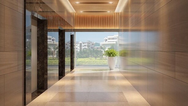 A modern hallway with a view of buildings and greenery outside. - Charmington La Pointe - Central Suites D (Ho Chi Minh City)