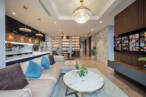 Superior Apartment, 4 Bedrooms, Kitchen, City View | Living area | 35-inch TV with cable channels