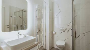 Apartment, 2 Bedrooms | Bathroom | Shower, rainfall showerhead, hair dryer, towels