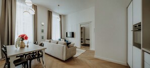 Apartment, 2 Bedrooms | Living area | Smart TV, books, offices