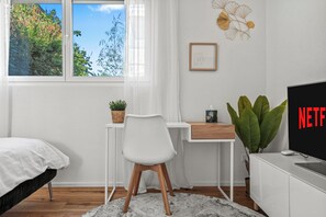 1 bedroom, desk, iron/ironing board, travel cot