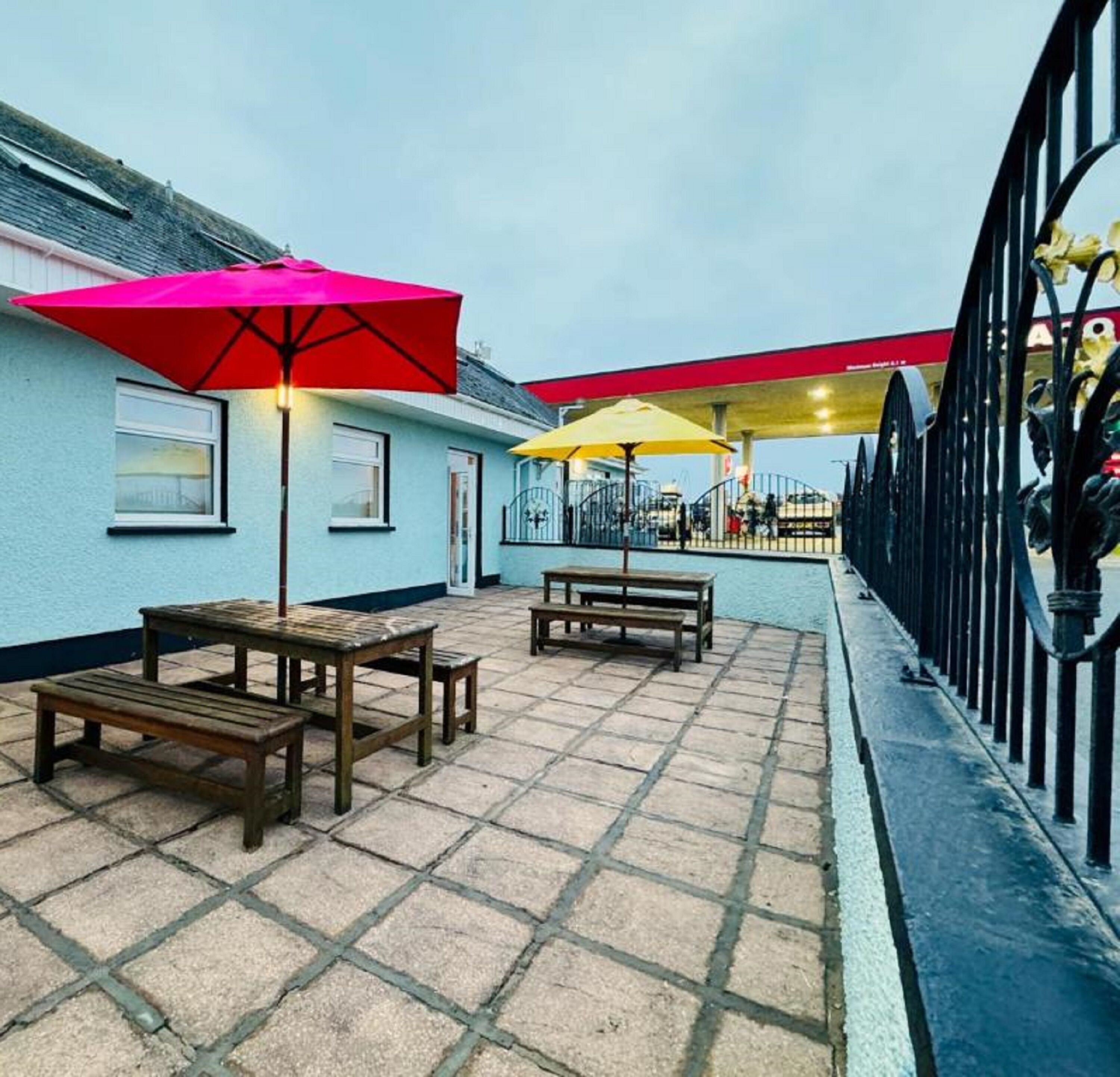 A patio area with outdoor seating and umbrellas.