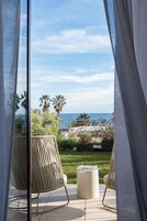 Deluxe Double Room, Patio, Sea View | Minibar, in-room safe, blackout drapes, soundproofing