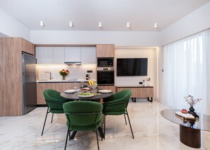 Deluxe Apartment, 1 King Bed with Sofa bed, City View | Living area | Flat-screen TV - Arc Elegant Apartments (Chania)