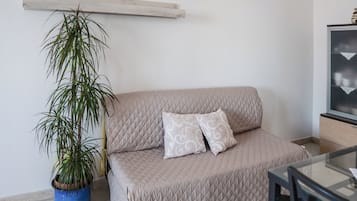 Apartment, 2 Bedrooms, Balcony | Living area | Flat-screen TV