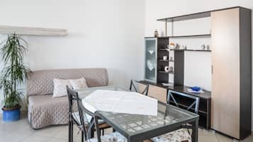 Apartment, 2 Bedrooms, Balcony | Living area | Flat-screen TV