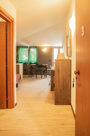 Apartment, 1 Bedroom, Balcony | Living area | Flat-screen TV - Appartamento Edolo, Bilocale & Monolocale (Edolo)