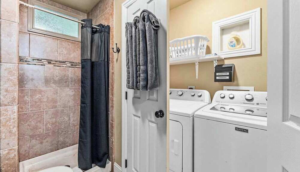 Shower, hair dryer, towels, shampoo