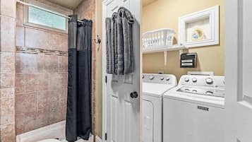 Shower, hair dryer, towels, shampoo