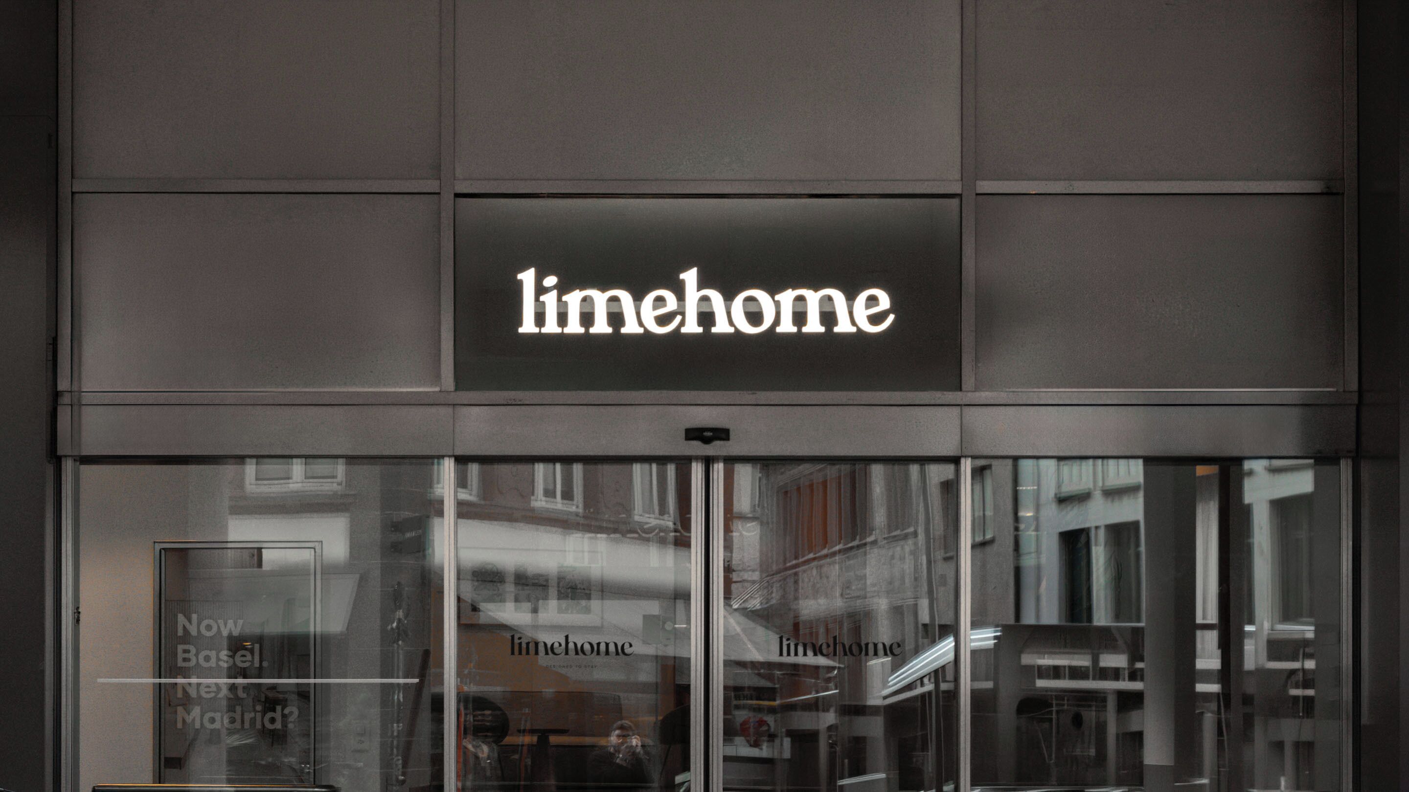 A building with a sign reading 'limehome' above the entrance.