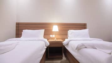 Habitación cuádruple familiar | Sábanas de algodón egipcio y ropa de cama de alta calidad