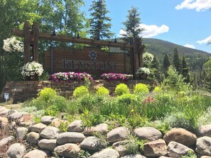 Welcome to Keystone, a charming destination surrounded by lush greenery and vibrant flowers.