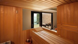 A sauna room with wooden benches and a view of a balcony with outdoor furniture. - 10 Rooms Twin Villas with Amazing views of the Adriatic Sea and Elafiti islands (Dubrovnik)