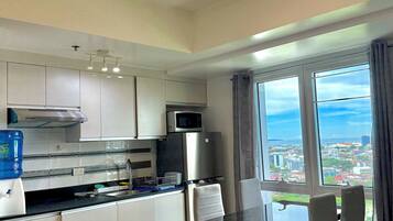Fridge, microwave, electric kettle, cookware/dishes/utensils