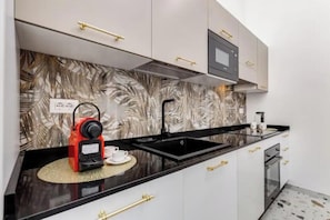 Fridge, microwave, oven, stovetop - Historic 4-Suite Villa with Lush Gardens and Luxurious Hall in Rome






 (Roma)
