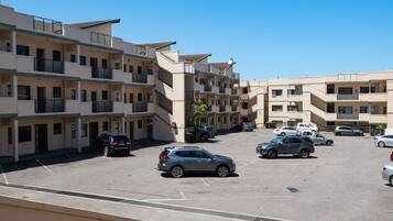 A multi-story parking garage with several cars parked.
