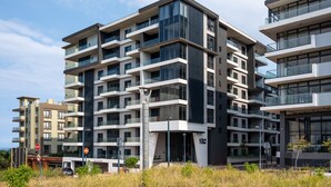 A multi-story residential building with balconies, large windows, and a modern architectural design. - Luxury Bellagio 303 (uMhlanga Ridge, KwaZulu-Natal)