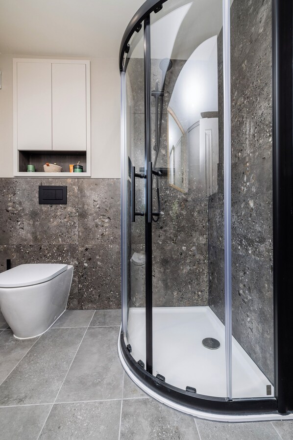 Shower, hair dryer, towels, soap