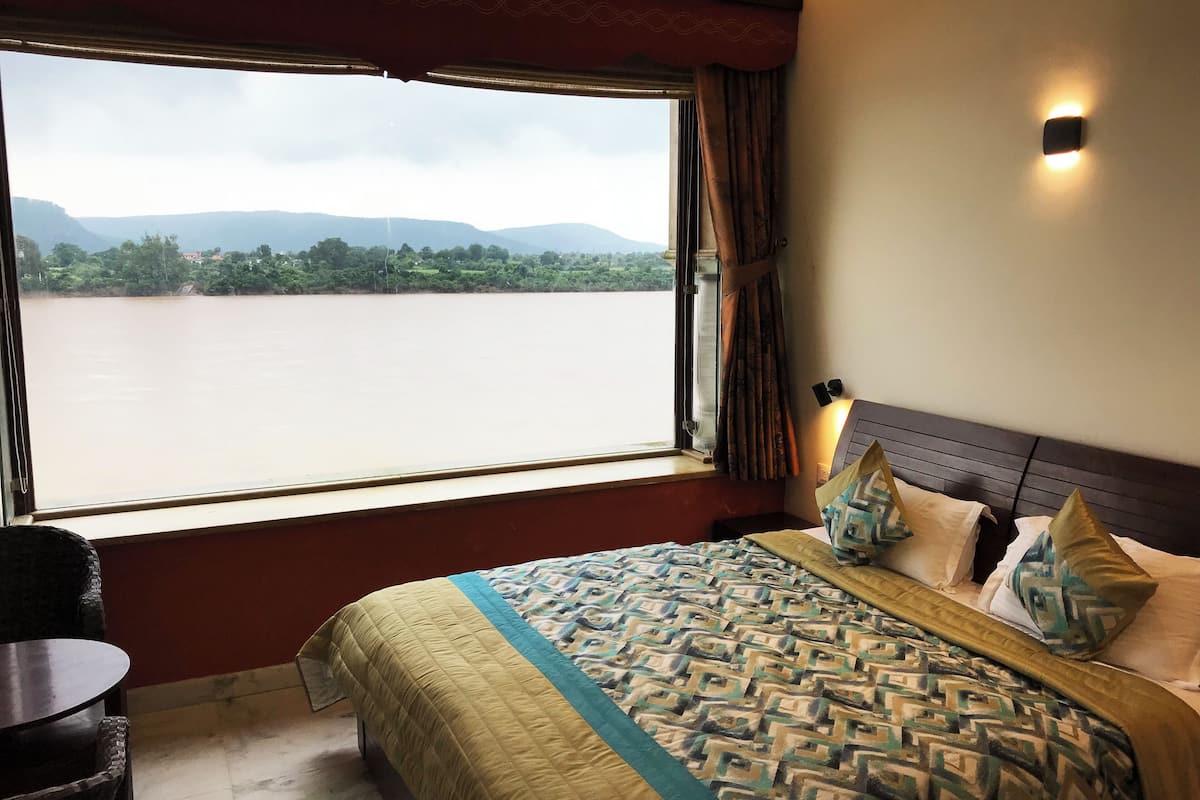 Premium Room, River View | 1 bedroom, desk, laptop workspace, blackout drapes