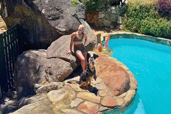 Cool off with your pups! Our bush swimming pool is dog‑friendly and surrounded by nature