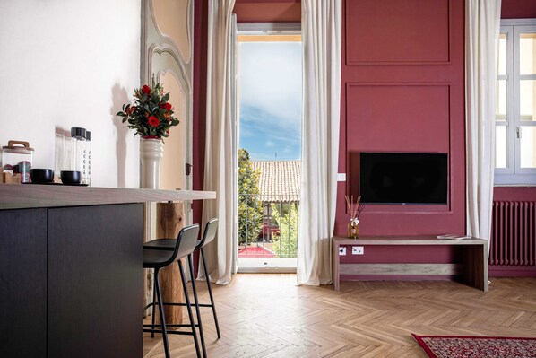 Junior Suite, City View | Living area | 50-inch TV with satellite channels