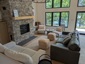 Smart TV, fireplace, books, computer monitors