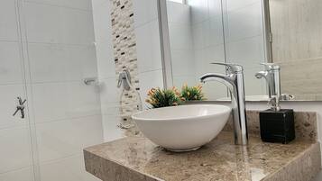 Shower, towels, soap, toilet paper