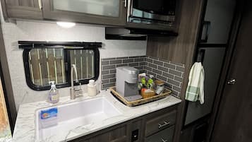 Fridge, microwave, stovetop, coffee/tea maker