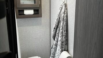 Shower, towels, soap, toilet paper