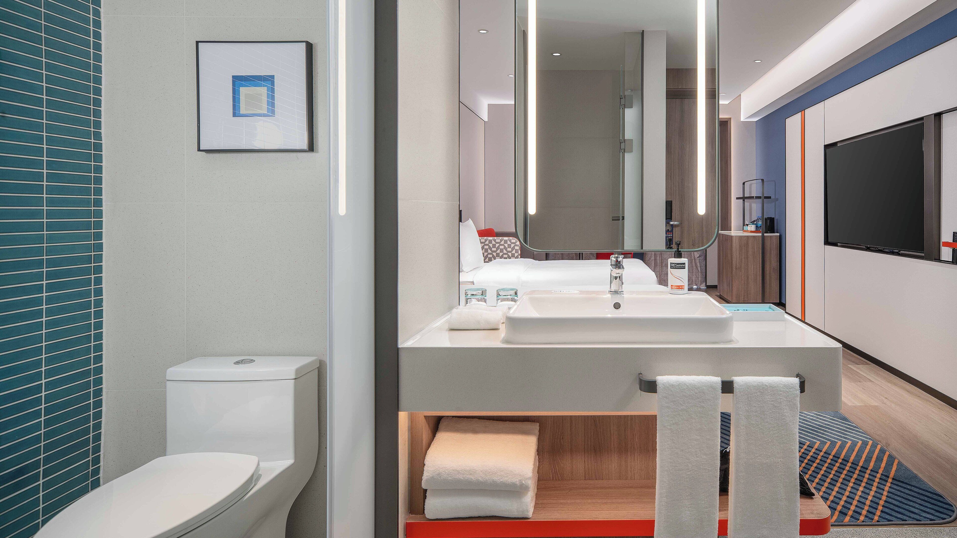 Shower, hair dryer, slippers, towels