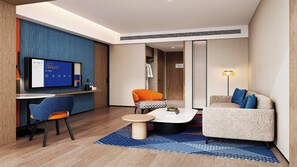 Cubrecamas, escritorio y espacio para trabajar con laptop 