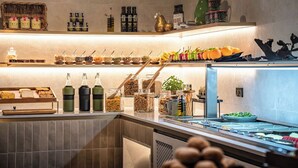 A buffet area with various food items, condiments, and beverages. - Doubletree By Hilton Hobart (Hobart)