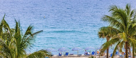 On the beach, sun loungers