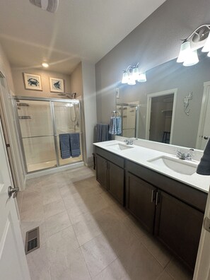 Shower, hair dryer, towels, soap