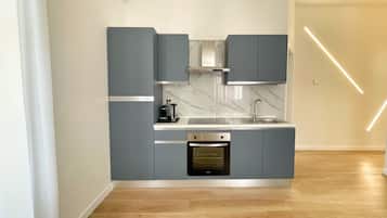 Deluxe Apartment, City View | Private kitchen | Full-sized fridge, oven, stovetop, espresso maker